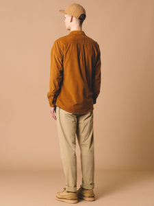 The back profile of the Dirleton Shirt from menswear designer KESTIN, worn by a model in the Tobacco Brown colour.
