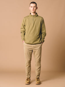 A model wearing the Crieff Windbreaker by KESTIN in Military Green.