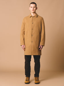 A model wearing the Edinburgh Overcoat by menswear brand KESTIN, made in the UK from a premium, warm Italian Wool.