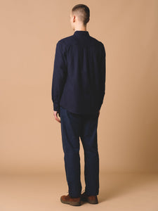 This model is showing the back profile of the Raeburn Button Down Shirt from premium Scottish menswear designer KESTIN.