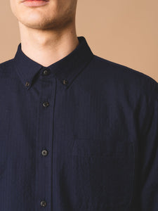 The button-down collar from a premium men's Raeburn Shirt, designed by premium clothing label KESTIN.