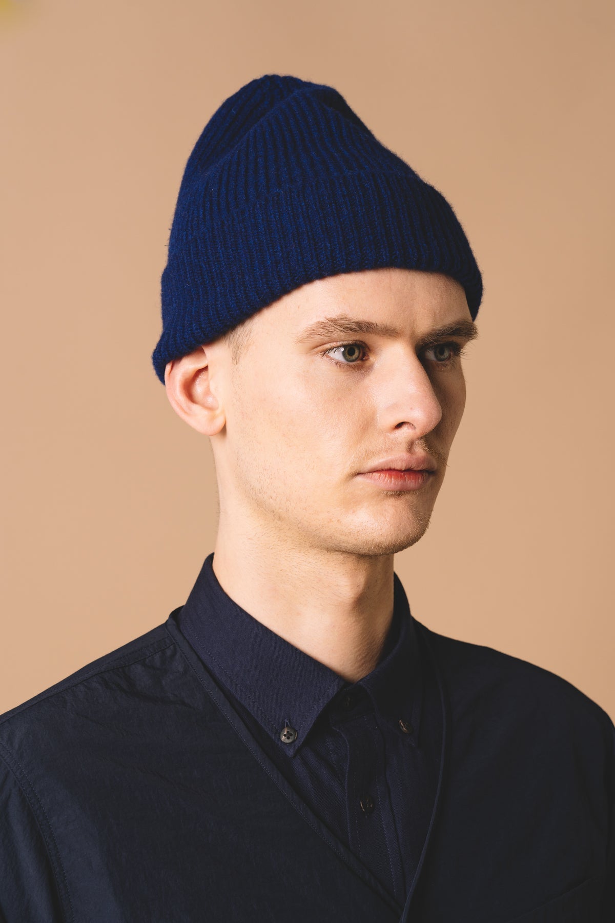 A men's lambswool beanie, made in Scotland by menswear designer KESTIN, in blue.