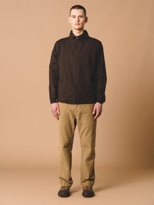A man wearing the dark brown Crieff Sweatshirt by Scottish designer KESTIN.