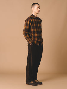 The KESTIN Men's Dirleton Flannel Shirt is seen here on a model, worn with the Wick Trousers, made from a Dark Brown Corduroy.