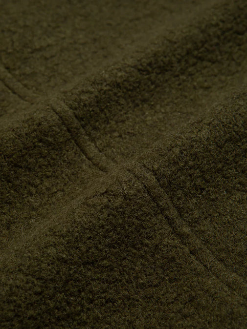 A green wool fleece fabric, soft and warm, used by clothing designer KESTIN.