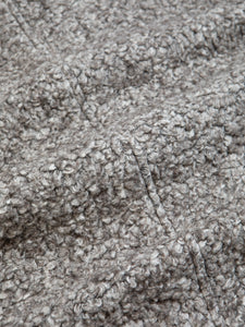 A natural Italian Wool, left undyed to show off the grey colour. This material is used to make warm winter jackets.