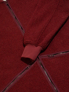 A ribbed cuff and zippered pockets from a winter fleece, designed by KESTIN.
