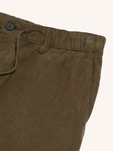 A green corduroy material used to construct the Inverness Trousers by KESTIN.