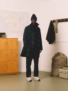 This model is wearing head-to-toe Black Watch Tartan, all designed by premium men's brand KESTIN.