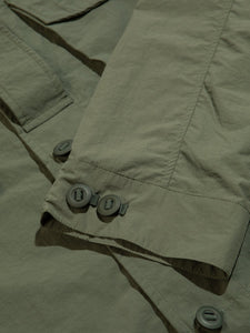 A buttoned, adjustable cuff from a lightweight Italian nylon shacket.