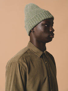 This model is wearing the KESTIN Men's Dirleton Shirt, paired with a Made in Scotland Beanie.
