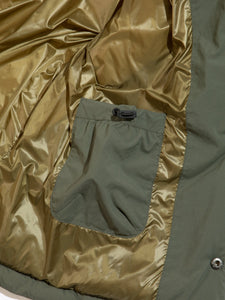 A patch pocket on the inside of a men's technical insulated jacket.