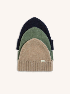 Three knitted men's beanies, made in Scotland from a soft and warm wool.