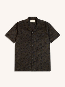 A men's short sleeve shirt in an ink blue paisley, on a white background.