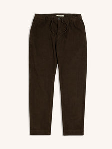 A pair of slim tapered trousers by menswear brand KESTIN, in a dark brown corduroy material.