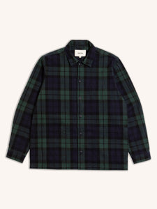 A classic men's chore coat, made from a flannel shirt material in a Black Watch tartan design.