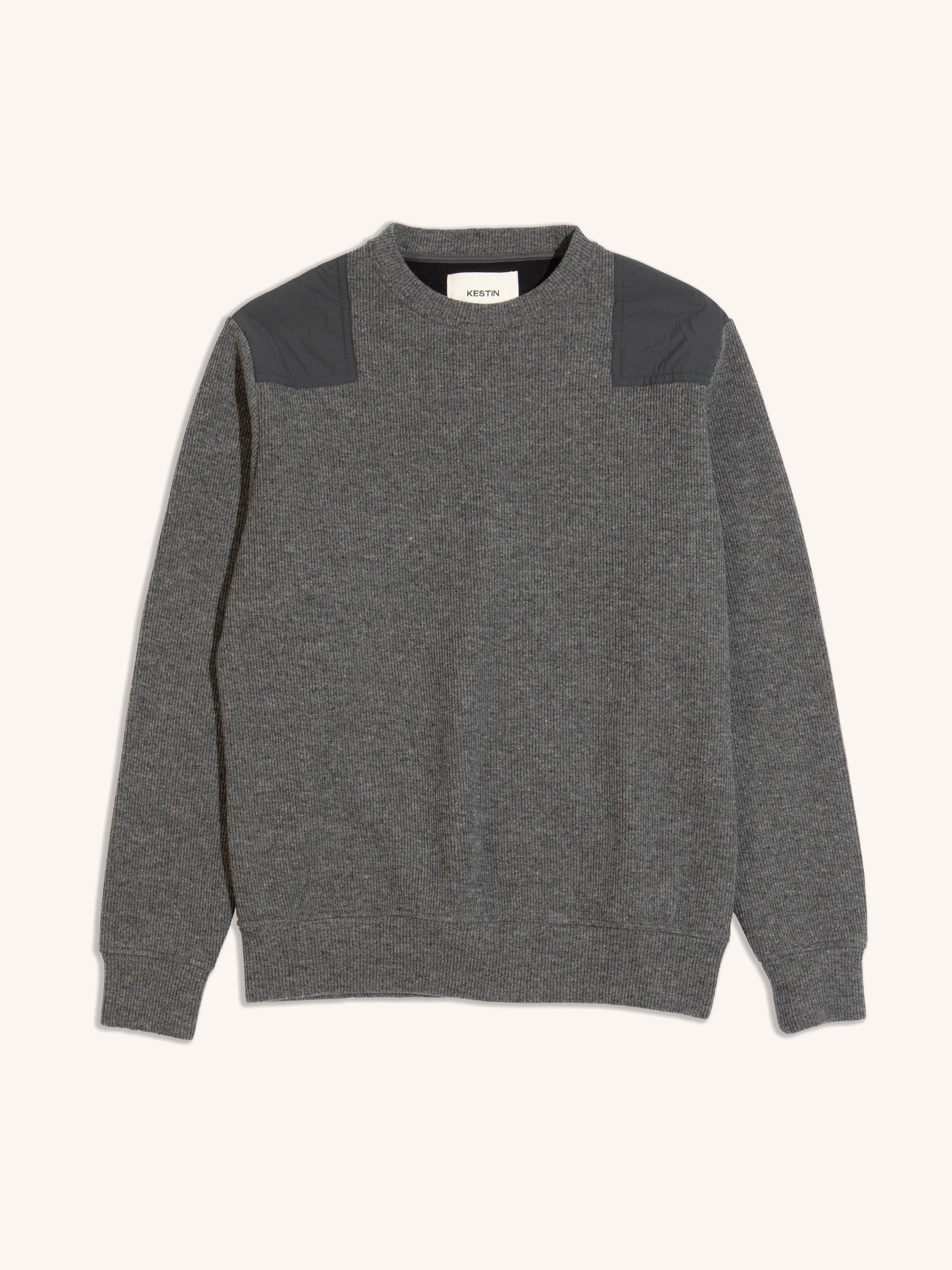A knitted sweater from KESTIN, made from a technical Japanese wool in grey.