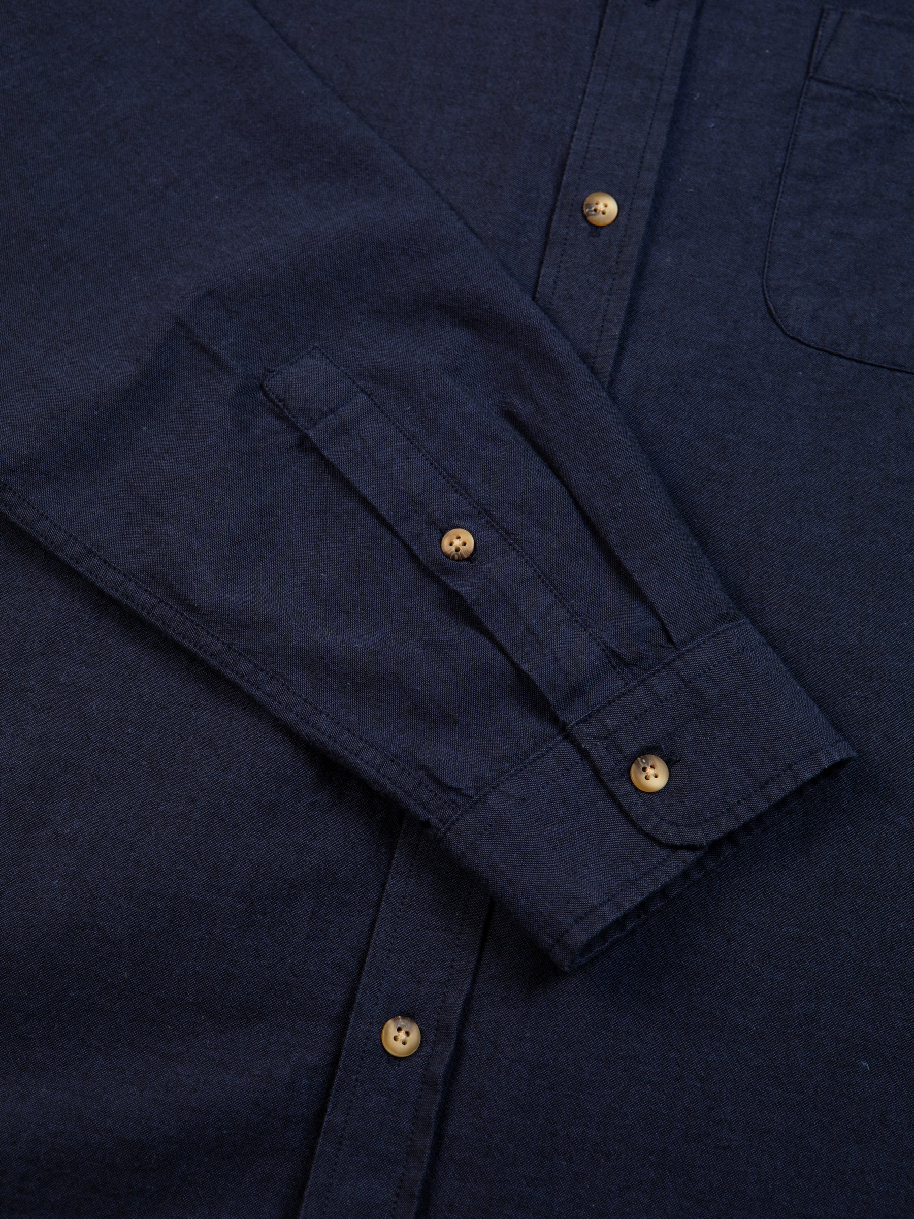 A buttoned shirt cuff from premium menswear brand KESTIN, made from a comfortable Oxford material.