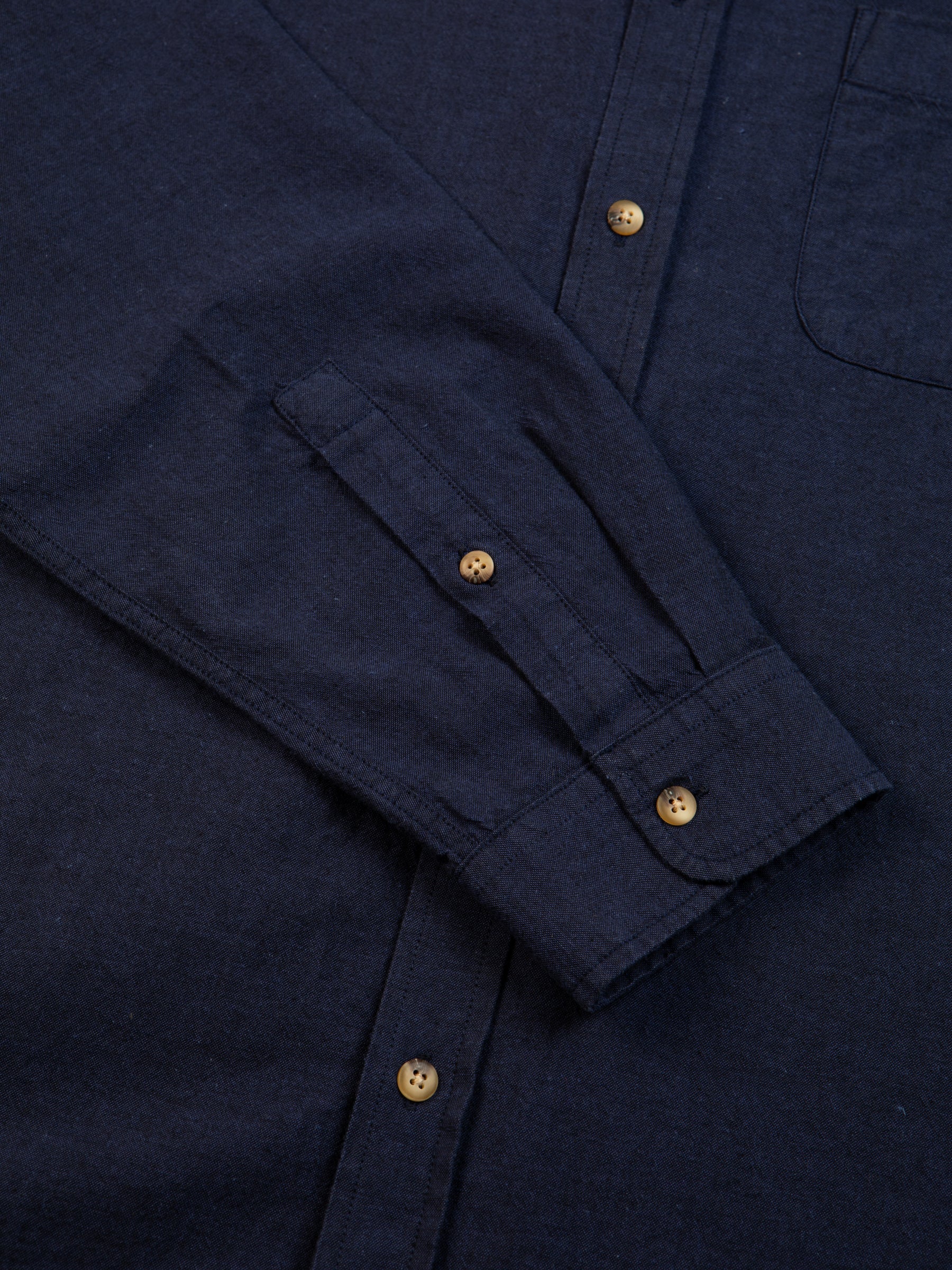 A buttoned shirt cuff from premium menswear brand KESTIN, made from a comfortable Oxford material.