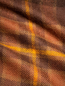 A soft wool fabric with a tartan check pattern, used to make KESTIN scarves.