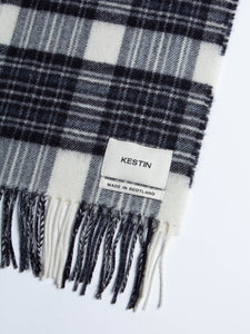 A woven logo patch to the Bowhill Tartan scarf by menswear brand KESTIN.
