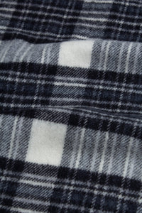 A Bowhill Tartan check pattern, used to make a soft wool scarf by KESTIN.