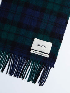 A woven logo patch and made in Scotland tag from a KESTIN scarf.