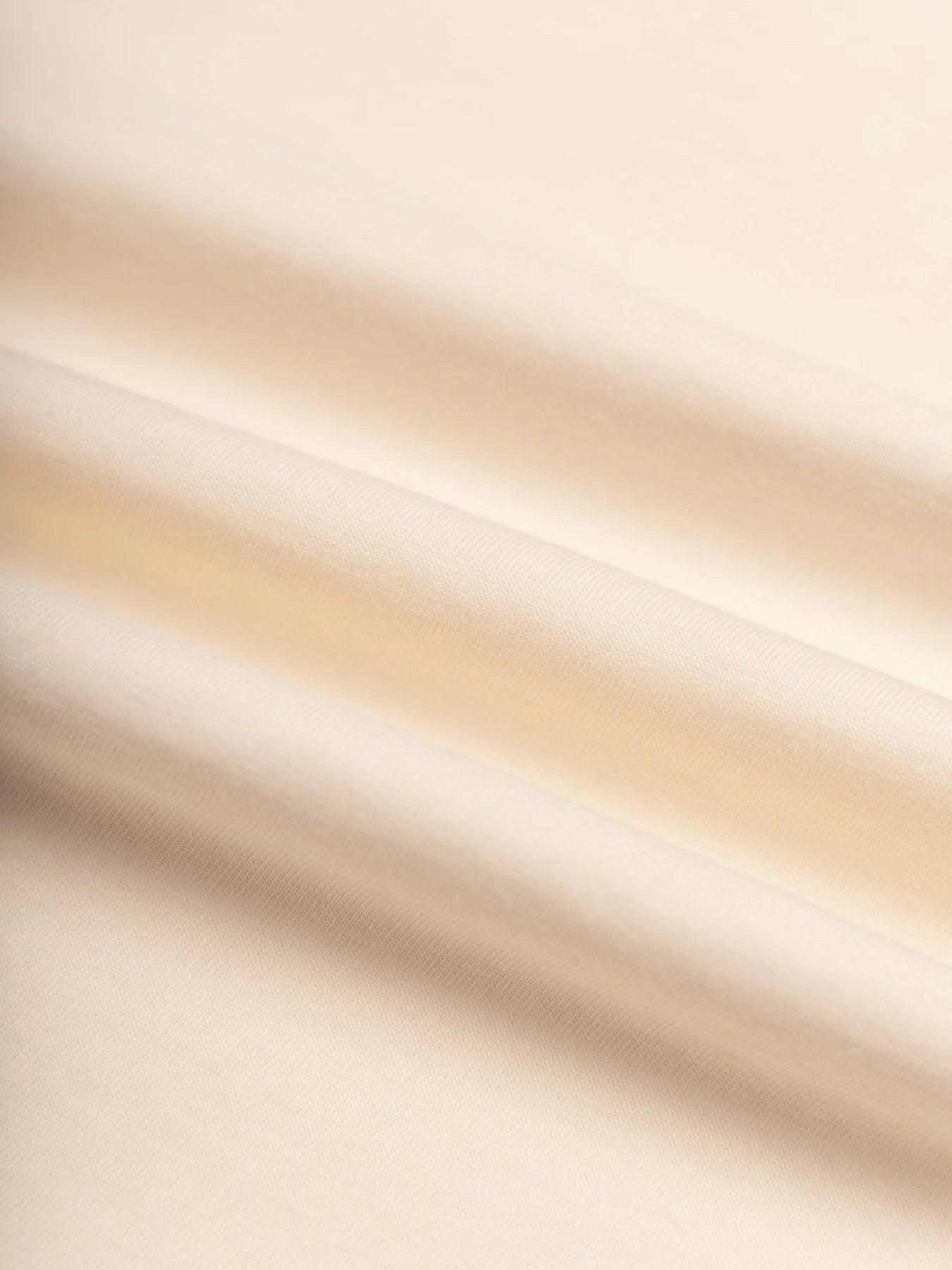 A heavyweight jersey fabric in ecru, used to make the KESTIN Fly Tee.