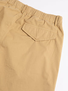 A close-up of the rear pocket of the KESTIN Clyde Pant in sand twill.