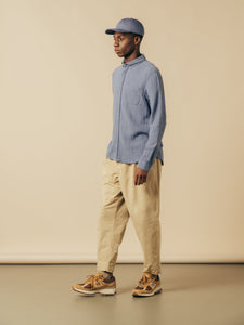 A model wearing a Spring outfit from menswear designer KESTIN, with New Balance.