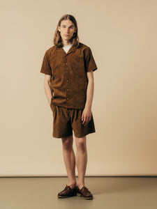 A model wearing a matching outfit from KESTIN, made from a brown Japanese Paisley.