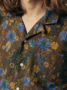 The camp collar of a men's floral shirt from Scottish menswear designer KESTIN.