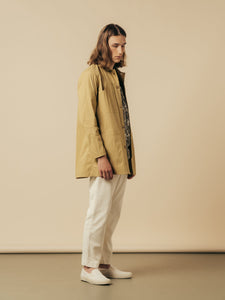 A model wearing an early-spring outfit, designed by premium menswear designer KESTIN.