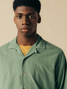 A model wearing the KESTIN Tain Shirt in Fern Green Corduroy.