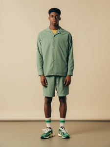 A model wearing a matching shorts and shirt combo from KESTIN.