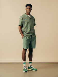 A man wearing a casual spring outfit from clothing designer KESTIN.