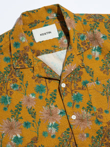 The buttoned front and camp collar of the KESTIN Crammond Shirt in yellow floral.