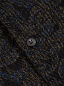 A button of the KESTIN Crammond Shirt, made from Ink Blue corduroy with a paisley print.