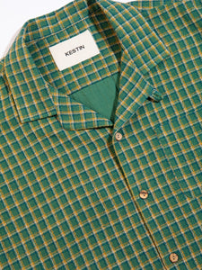 The button front and camp collar of the KESTIN Crammond Shirt in green check.