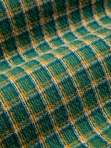 A woven material made from a premium Japanese cotton, with a green check.