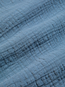 A textured blue fabric, used to make the KESTIN men's Raeburn Shirt.
