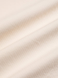 A white, textured stripe material, used for the KESTIN SS24 Collection. 