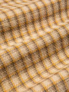 A woven cotton fabric with a beige check pattern, used by KESTIN for the SS24 collection.