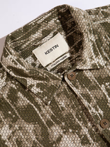 A close-up of the KESTIN Ormiston Jacket collar in a woven camo design.