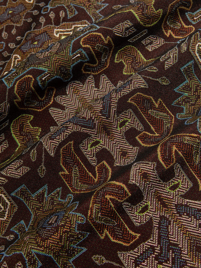 A premium Japanese Ikat Jacquard fabric in wine red, used by menswear brand KESTIN.