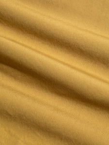 A close-up of a cotton poplin fabric in tan brown, used by menswear brand KESTIN.